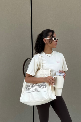 "THE WELLNESS ERA" CREAM TOTE BAG