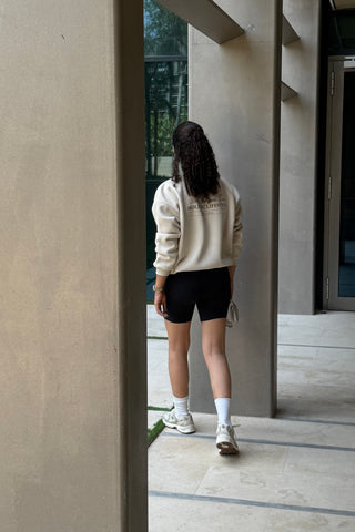 "THE WELLNESS ERA" OFF-WHITE SWEATSHIRT