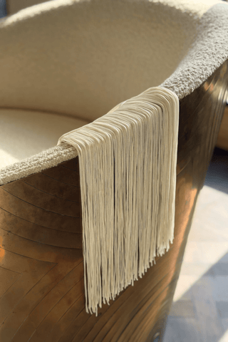 Ivory satin fringe pouch with knotted handle by Venus Karma