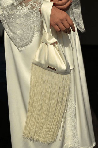 Ivory satin fringe pouch with knotted handle by Venus Karma