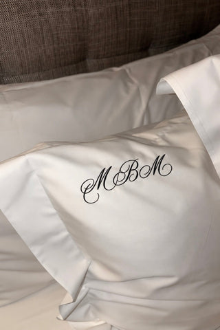 Embroidered white Egyptian cotton pillowcases, a luxury wedding and anniversary gift