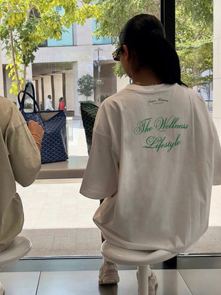 "THE WELLNESS LIFESTYLE" WHITE OVERSIZED T-SHIRT Venus Karma
